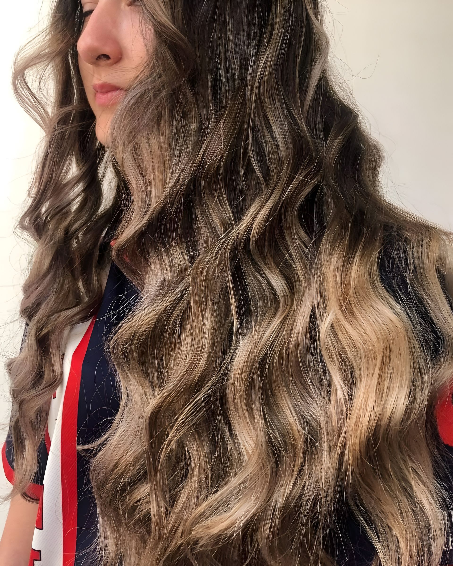 Woman With Long, Wavy Brown Hair With Blonde Highlights — 5th Ave Hair Lounge in Caloundra, QLD