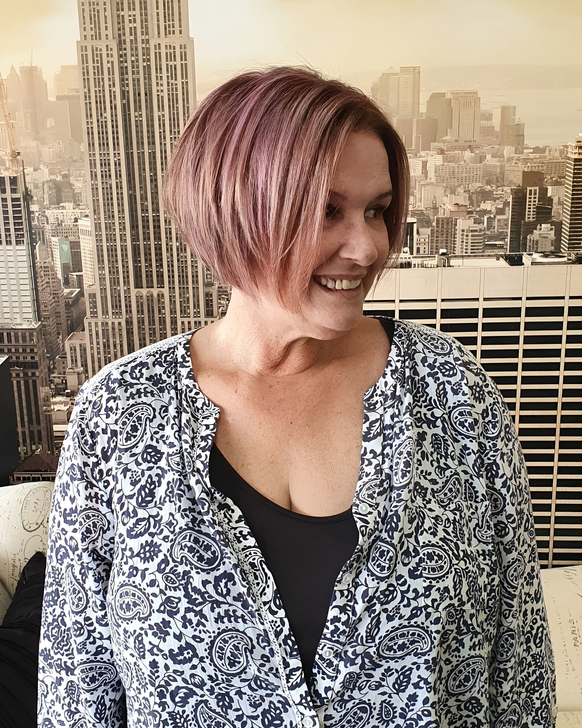 Woman With Pink-tinted Short Hair Smiles, Wearing a Patterned Top — 5th Ave Hair Lounge in Caloundra, QLD