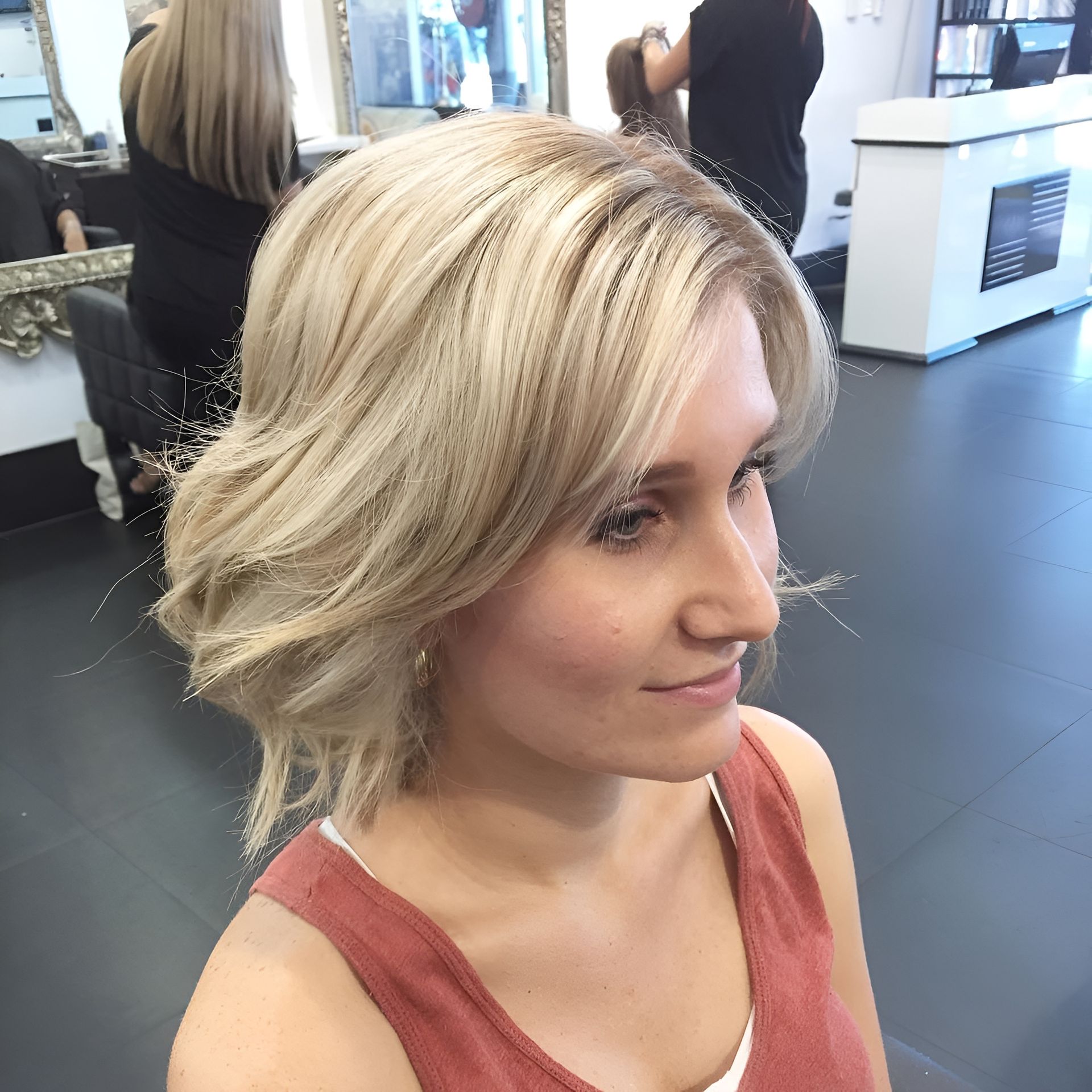 Blonde Woman With Wavy Bob Hairstyle, Smiling Slightly — 5th Ave Hair Lounge in Caloundra, QLD