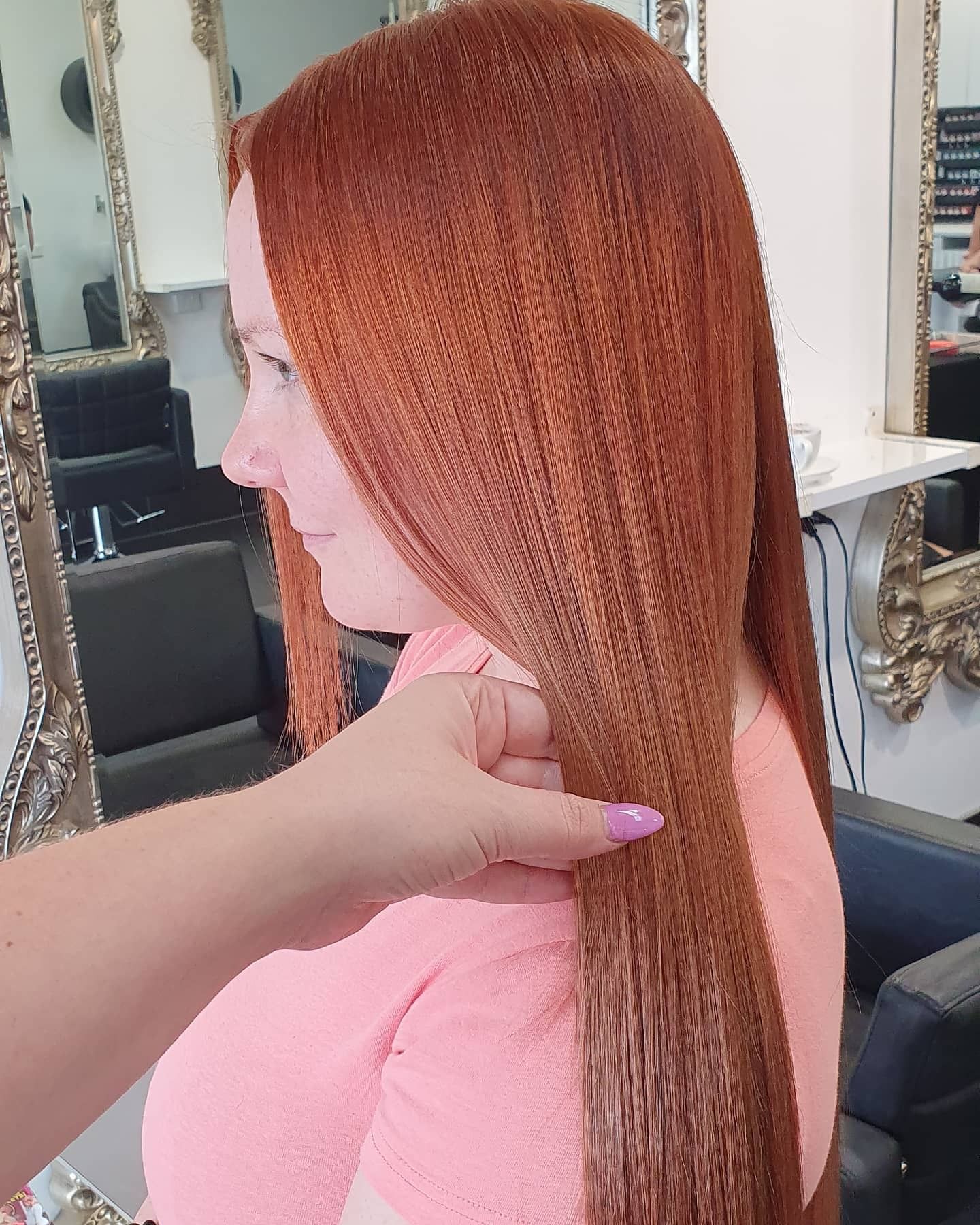 Woman With Long, Red Hair Being Held by Hand. Salon Setting, Pink Top — 5th Ave Hair Lounge in Caloundra, QLD