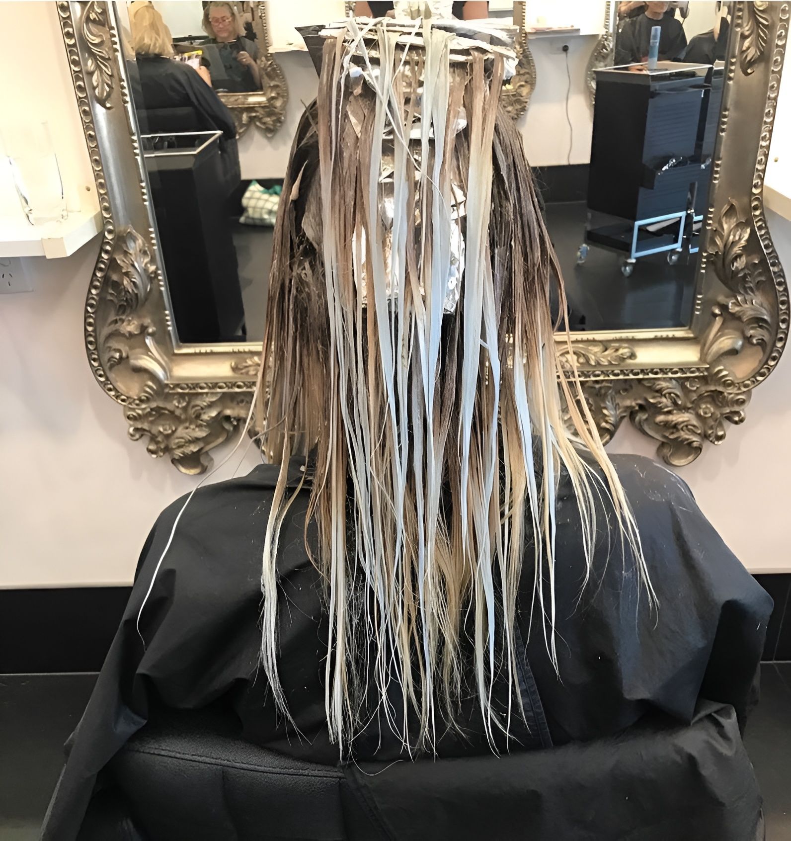 Person With Hair Covered in Foil Highlights at a Salon — 5th Ave Hair Lounge in Caloundra, QLD