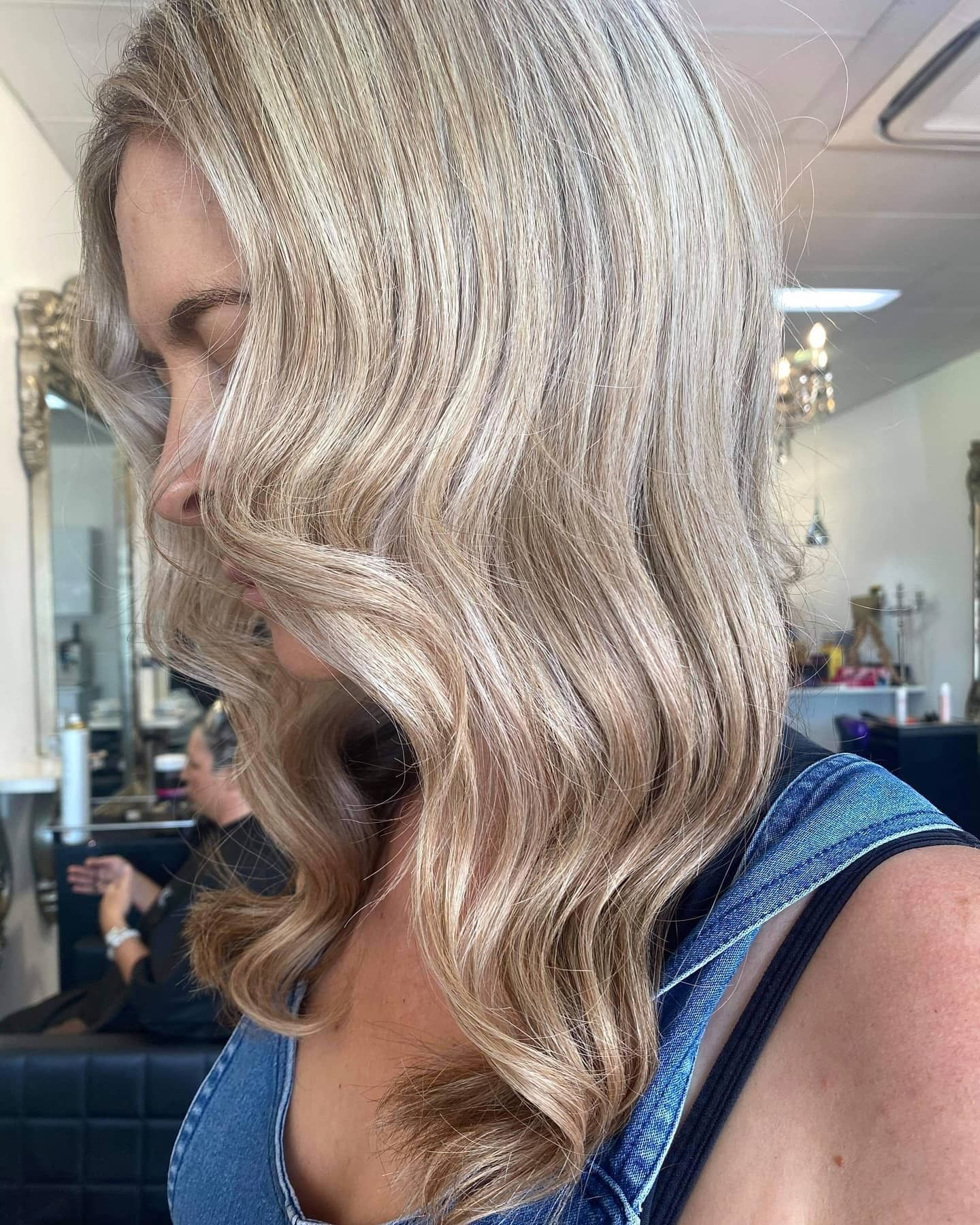 Blonde Woman With Wavy Hair, Wearing Denim — 5th Ave Hair Lounge in Caloundra, QLD