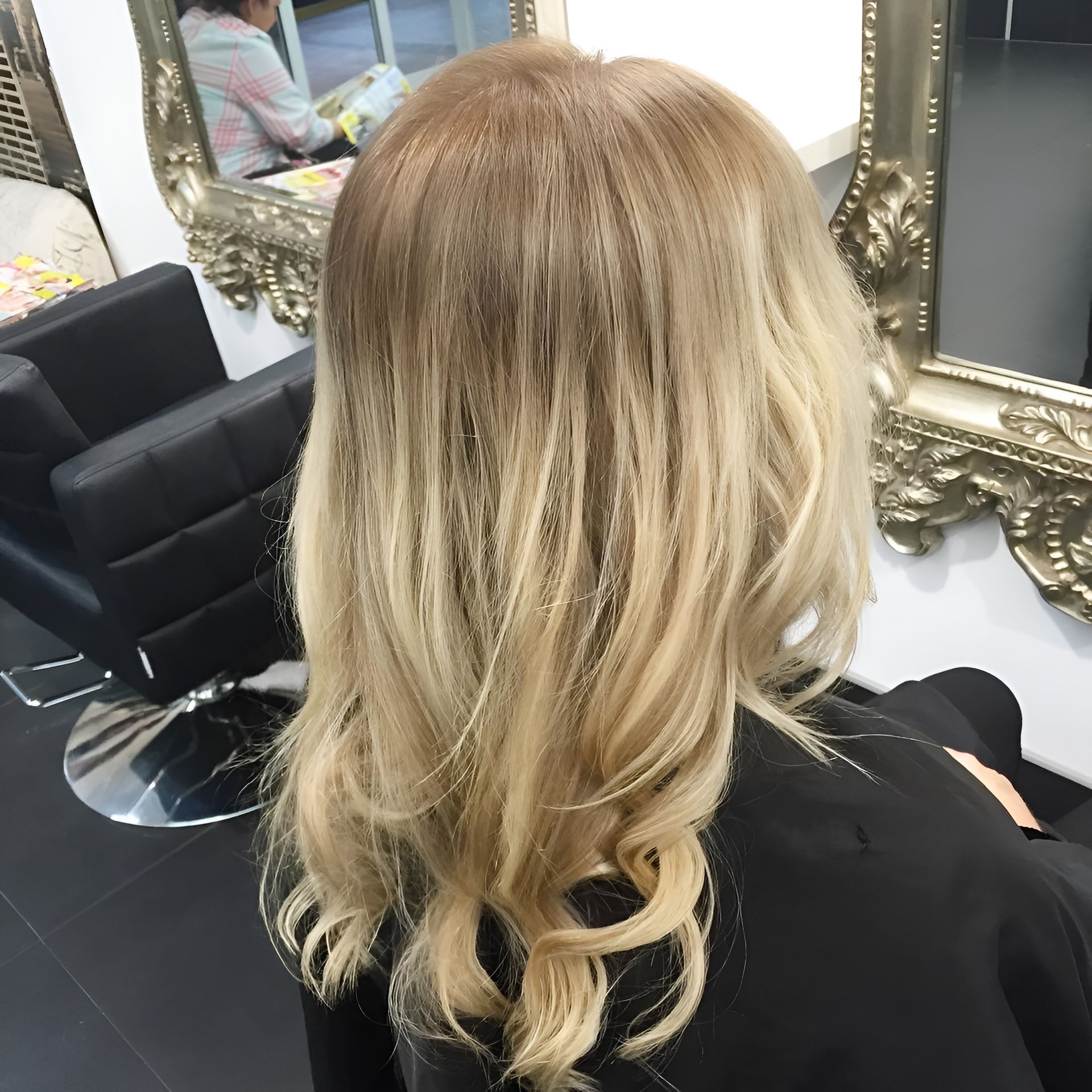 Blonde Wavy Hair With Darker Roots in a Salon Setting — 5th Ave Hair Lounge in Caloundra, QLD
