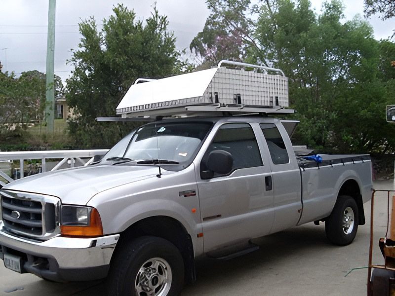 A Silver Truck With A White Canopy Box On Top Of The Roof — Brumb's Welding & Fabrication in Biggera Waters, QLD