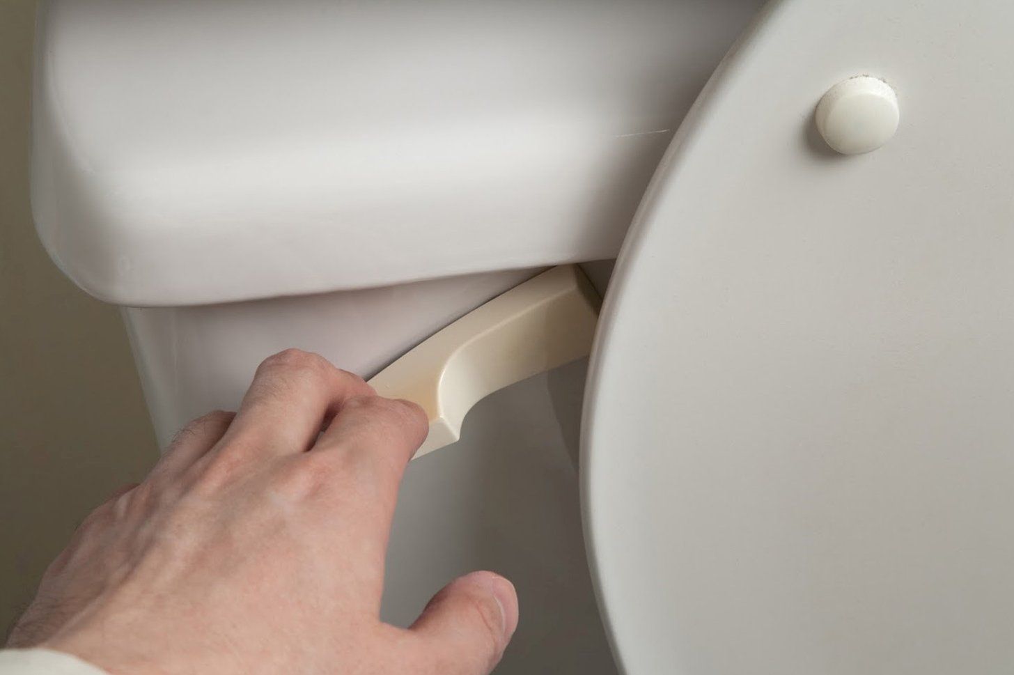 Man Flushing A Toilet — Albuquerque, NM — AAA Pumping Service Inc.