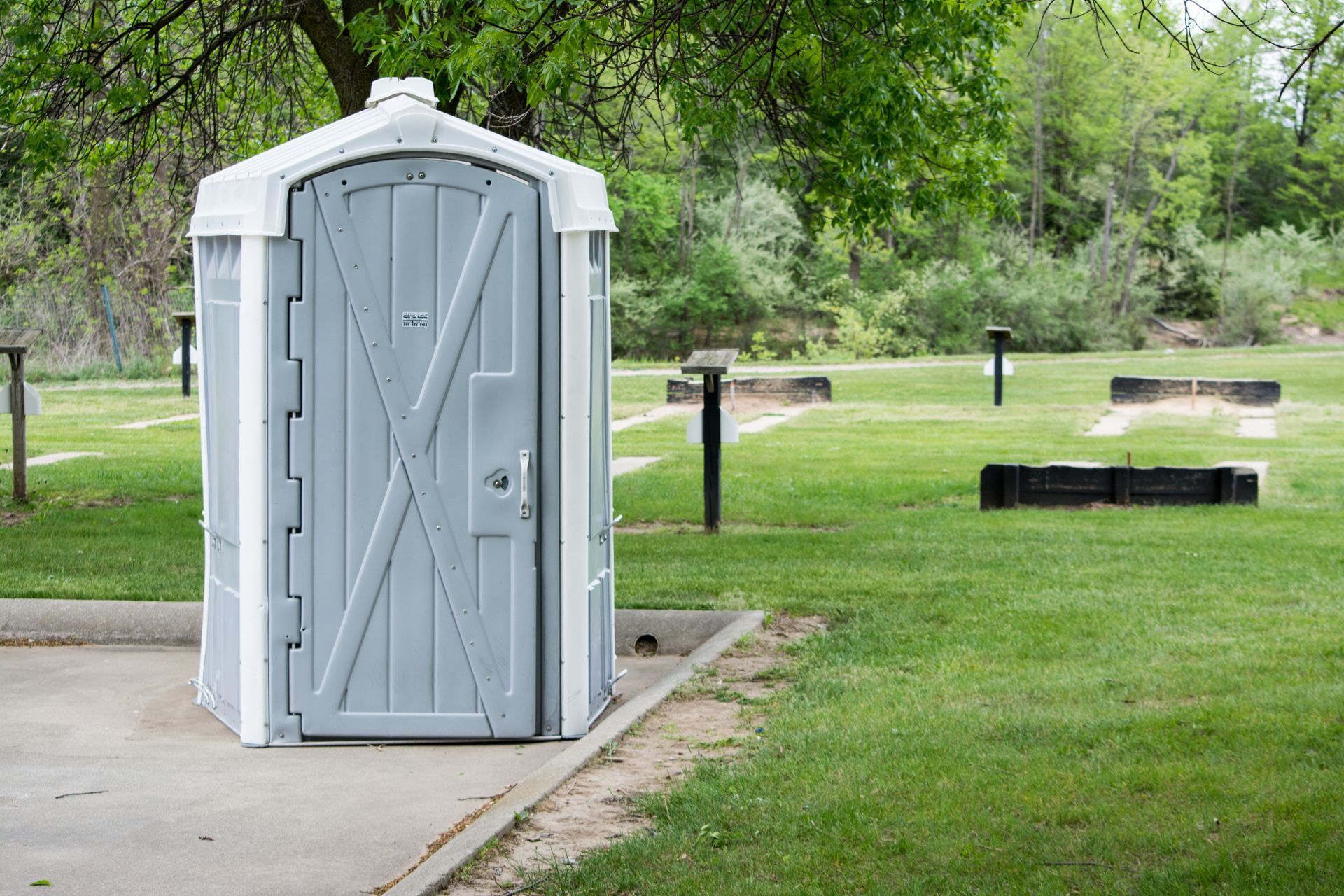 Row of clean portable restroom units available for porta potty rental. Row of clean portable restroom units available for porta potty rental.