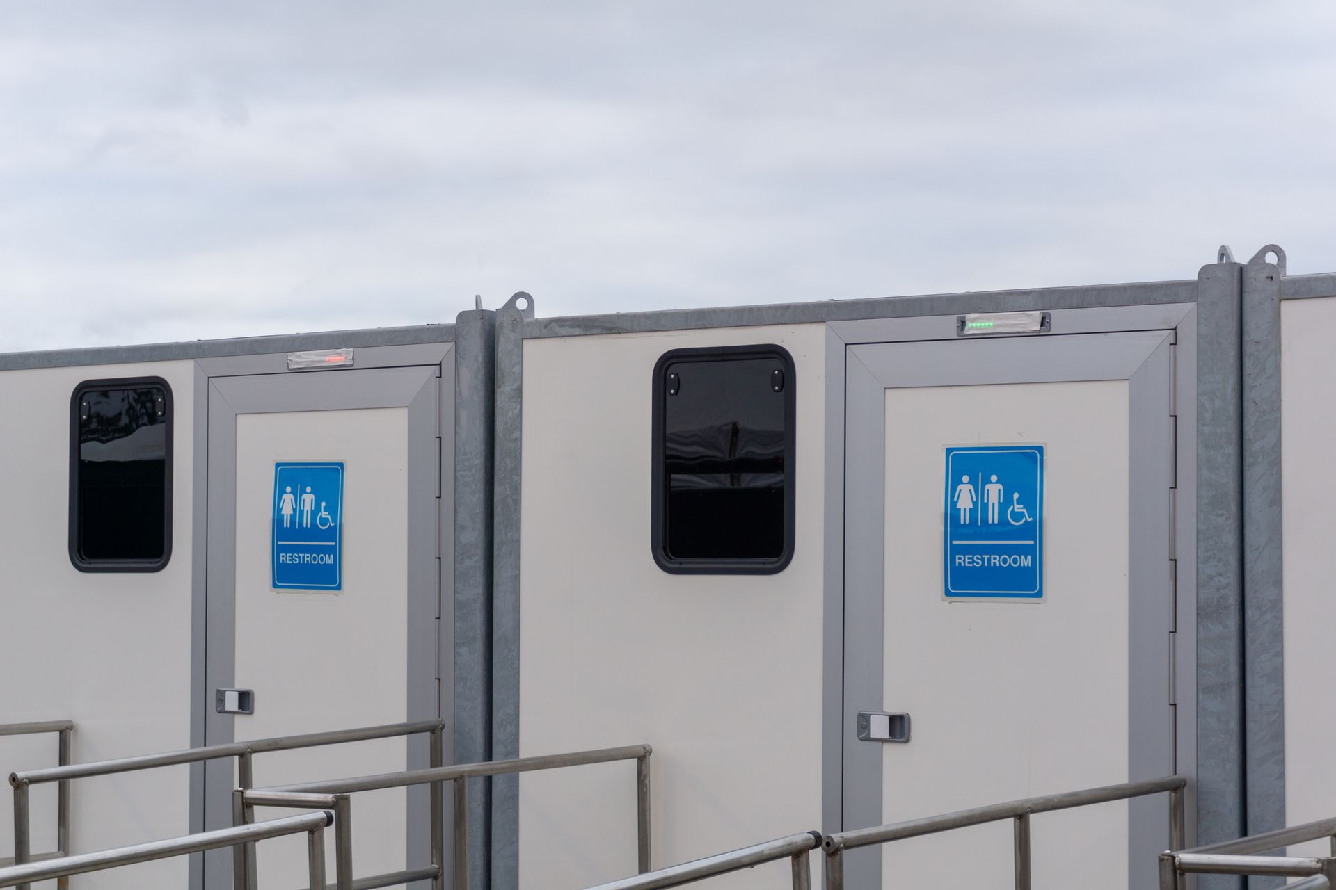 Modern Portable Restroom Trailer with clean, sleek design for outdoor events and convenience. Modern Portable Restroom Trailer with clean, sleek design for outdoor events and convenience.