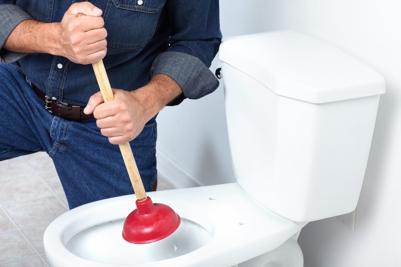 Man Pumping The Toilet — Albuquerque, NM — AAA Pumping Service Inc.