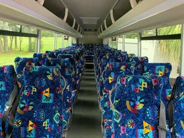 The Inside of a Bus With Blue and Colorful Seats — Wests National Coaches In Chevallum, QLD