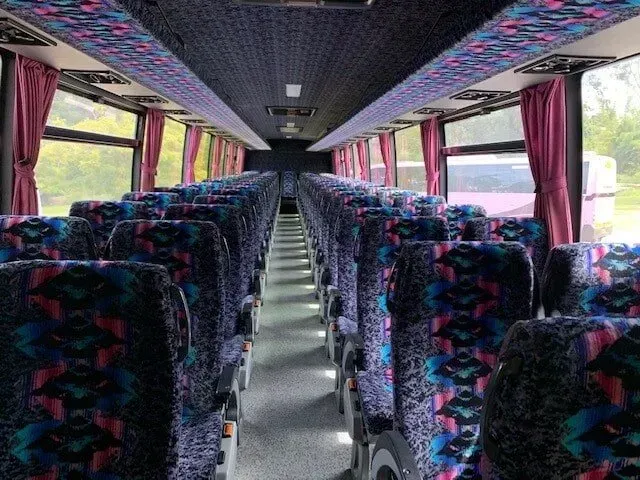 Empty Bus Interior with colourful seats — Wests National Coaches In Chevallum, QLD