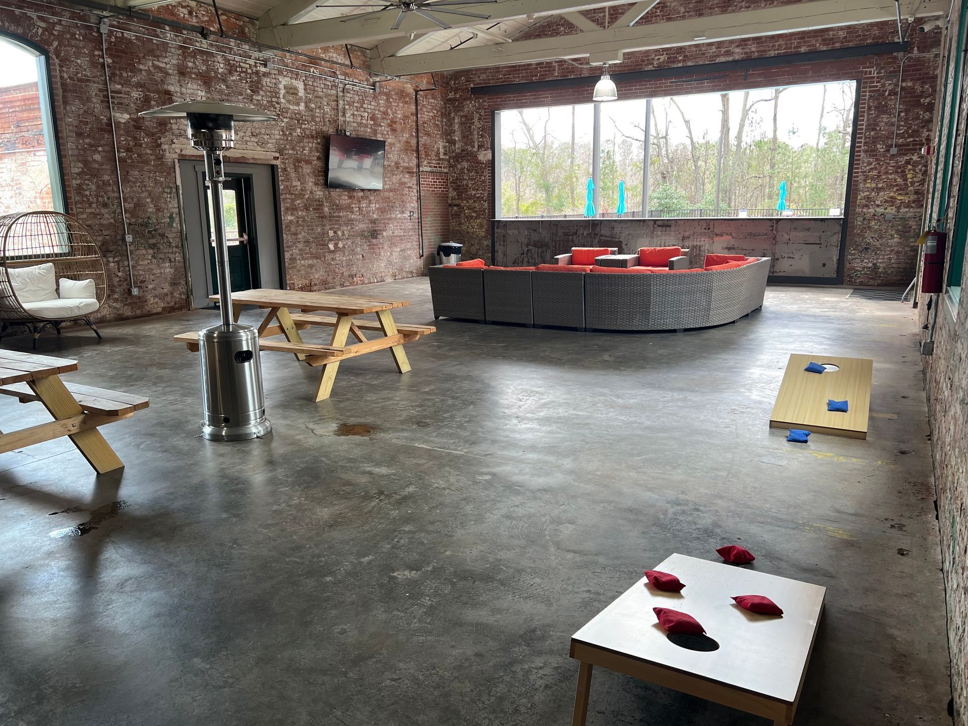 a large room with a couch and a picnic table