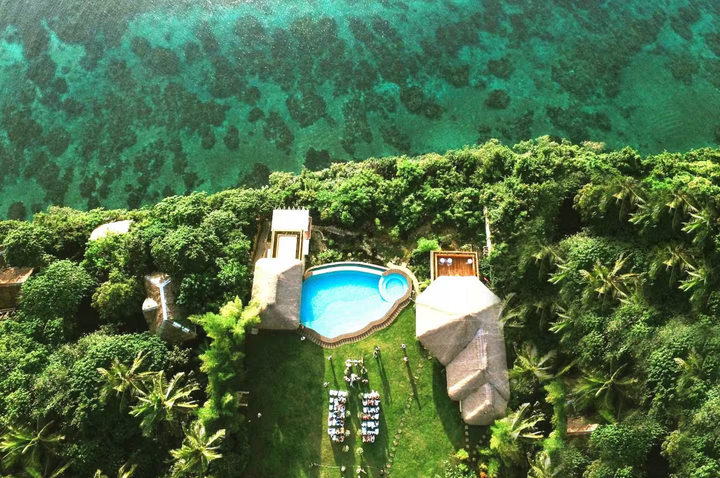 Aerial view of Pure Shores Villa showing the infinity pool and lush tropical gardens in Guindulman Bohol Philippines