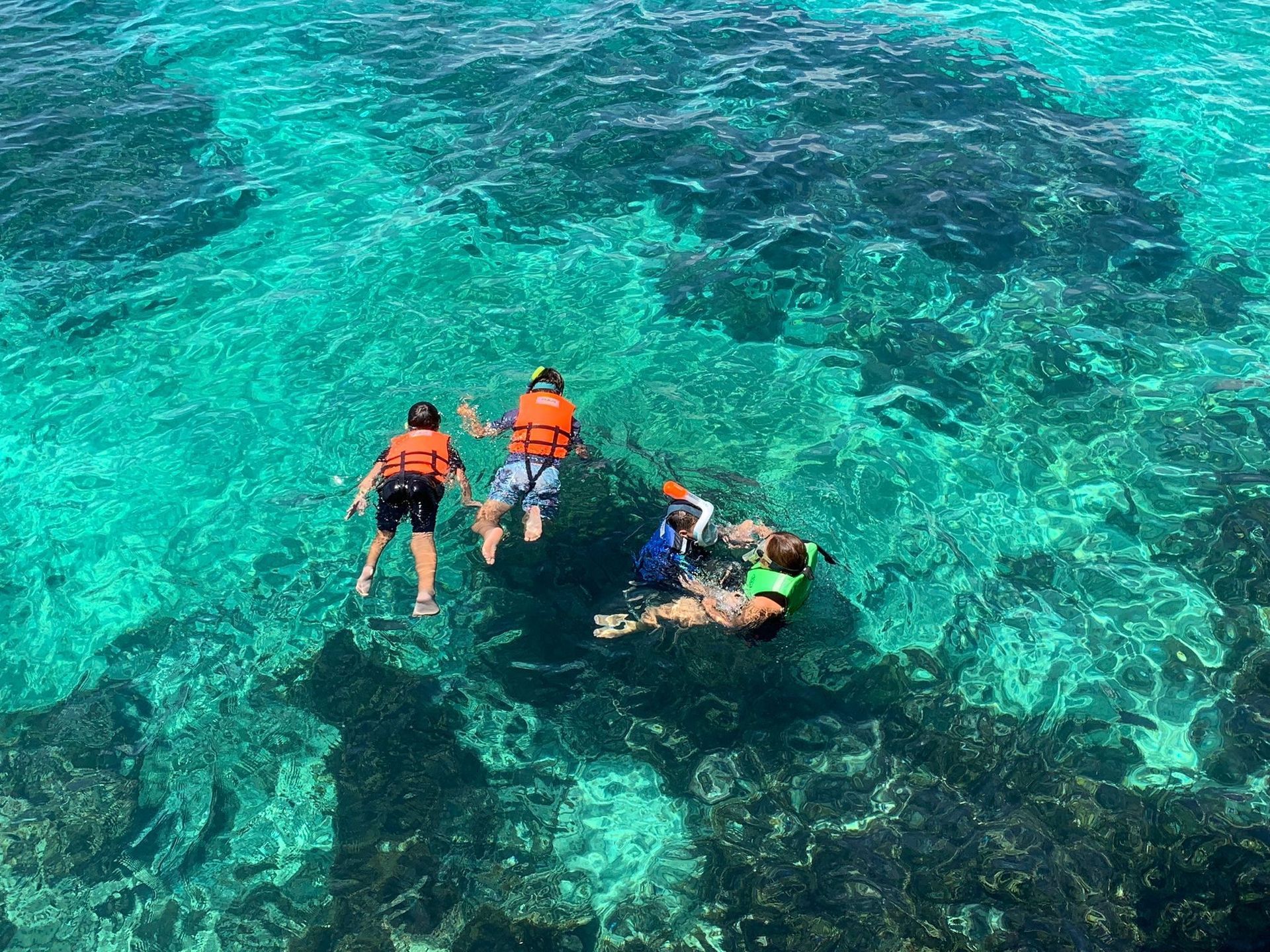 Guests snorkelling at Basdio Marine Sanctuary steps from Pure Shores Villa a private villa in Bohol Philippines
