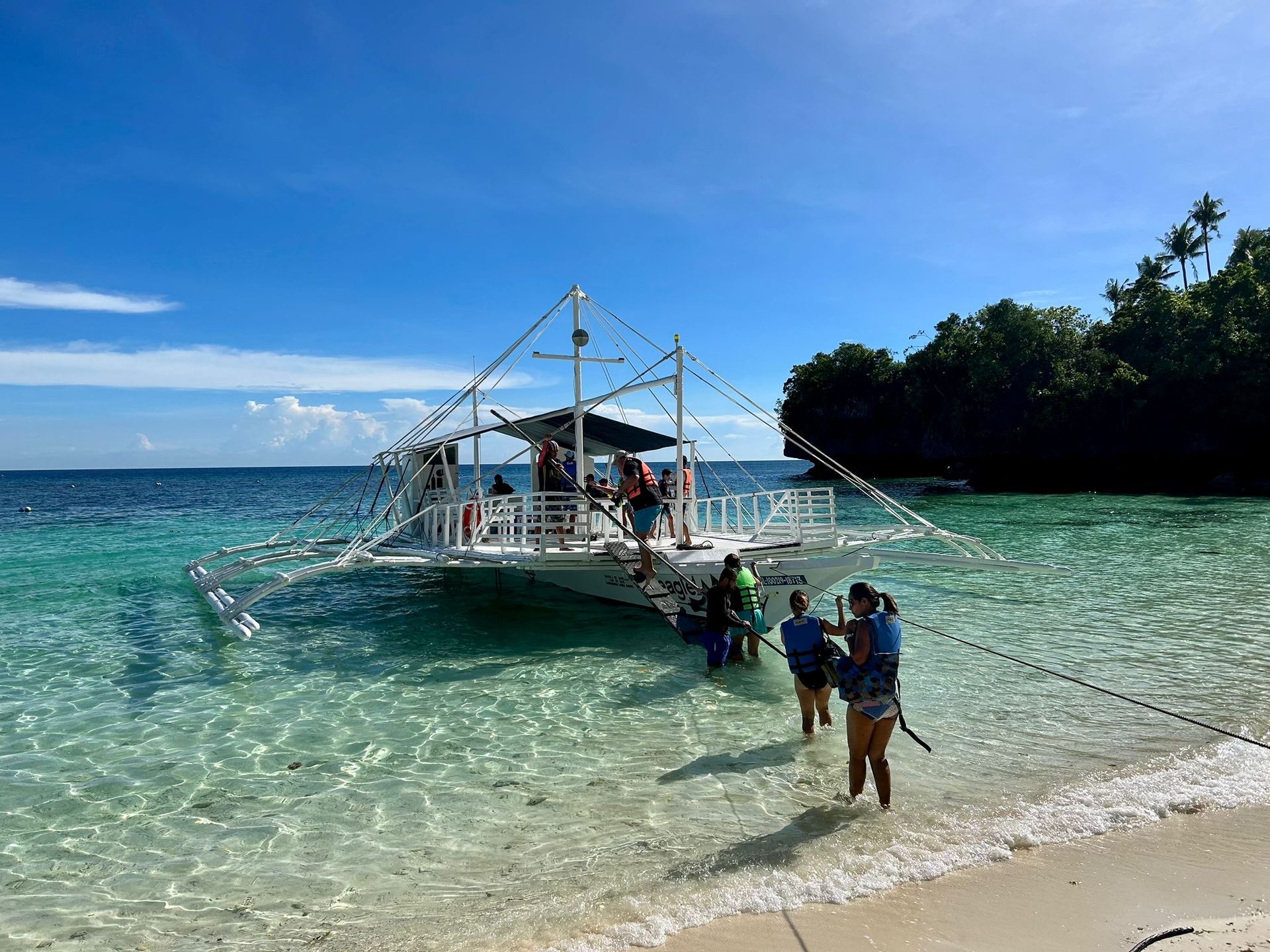 Traditional outrigger boat for island hopping in Bohol arranged by Pure Shores Villa for guests