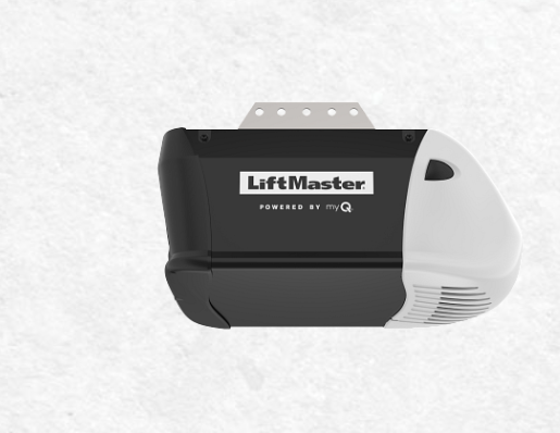 Hand holding a tape measure near a garage door opener on the ceiling