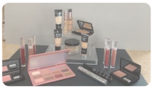 Assorted makeup products and palettes arranged on a tabletop display