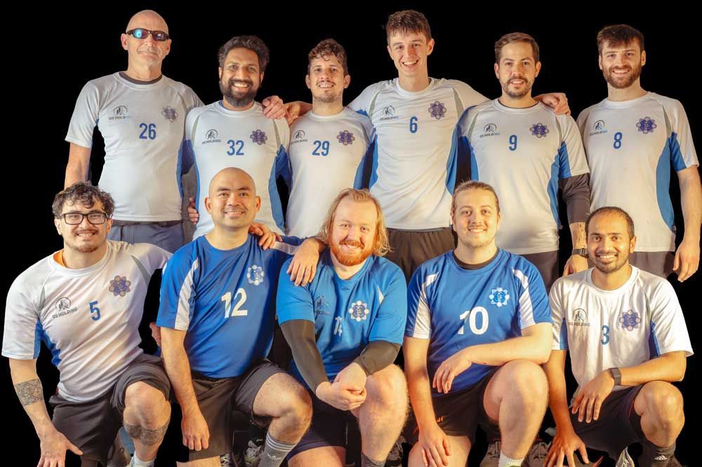 A group of men are posing for a picture together.