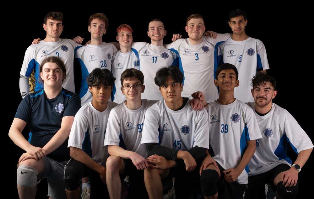 A group of young men are posing for a picture together.