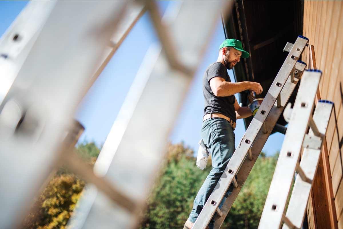 A person painting with Ben Waterbourne Exterior Paint