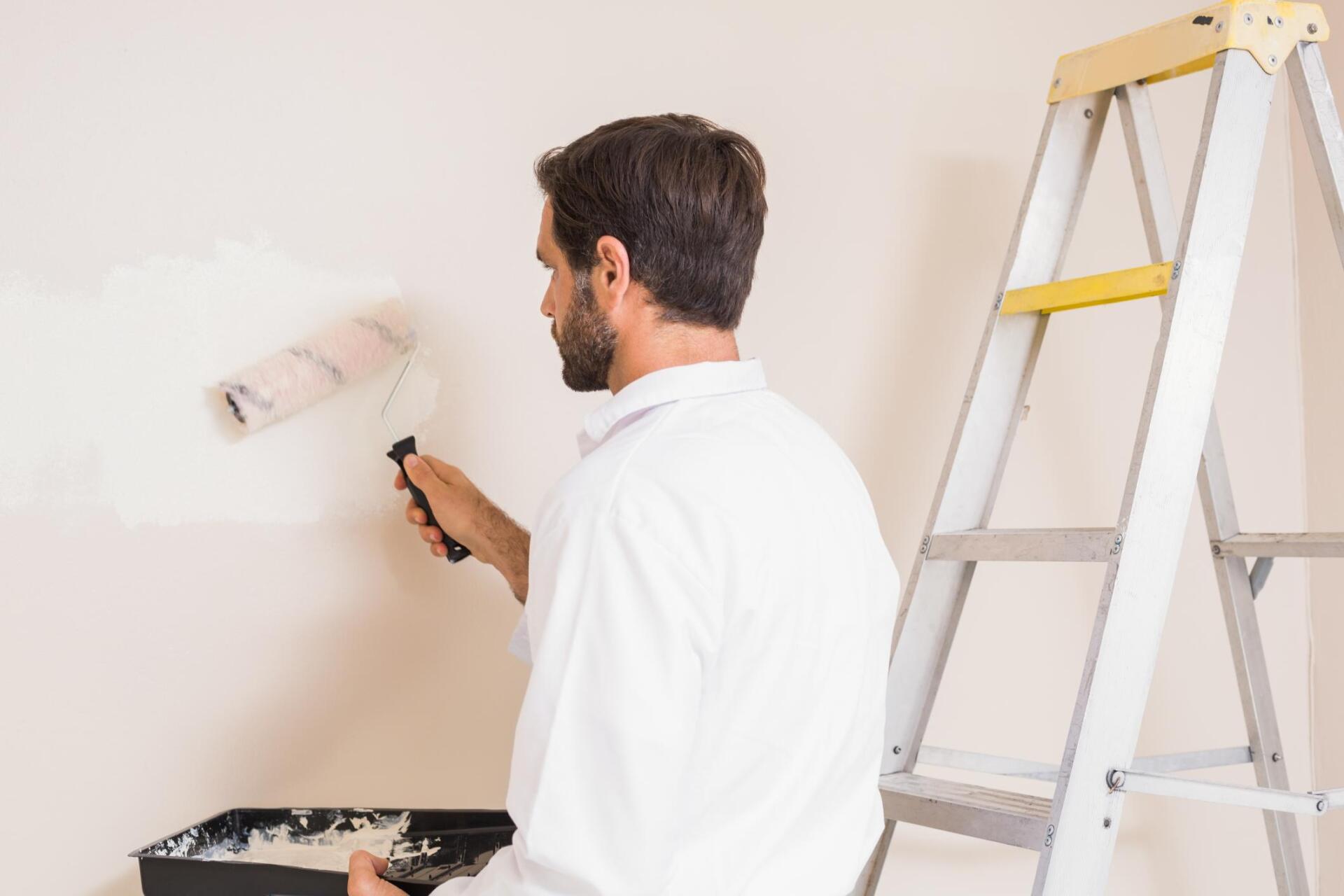 man painting the wall