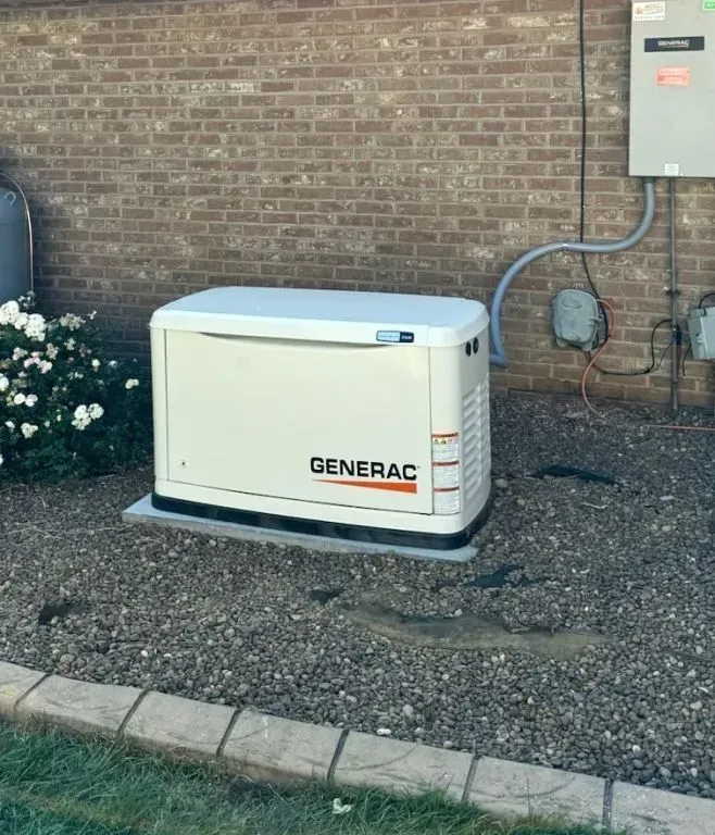 Two portable generators, one black and one yellow, side by side with control panels visible