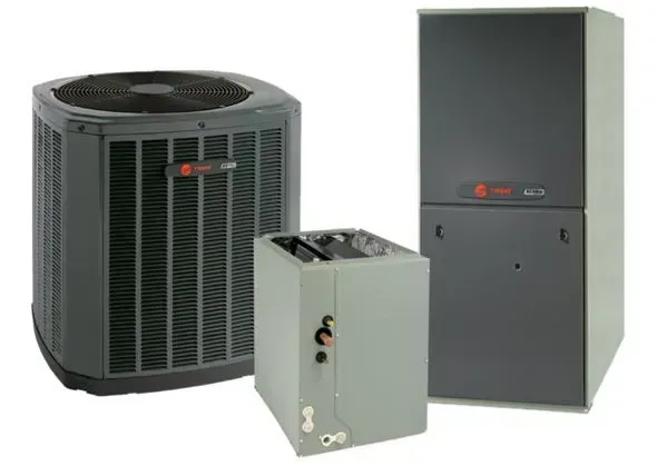 Three HVAC units: a large black outdoor condenser, a white cabinet, and a gray furnace/air handler.