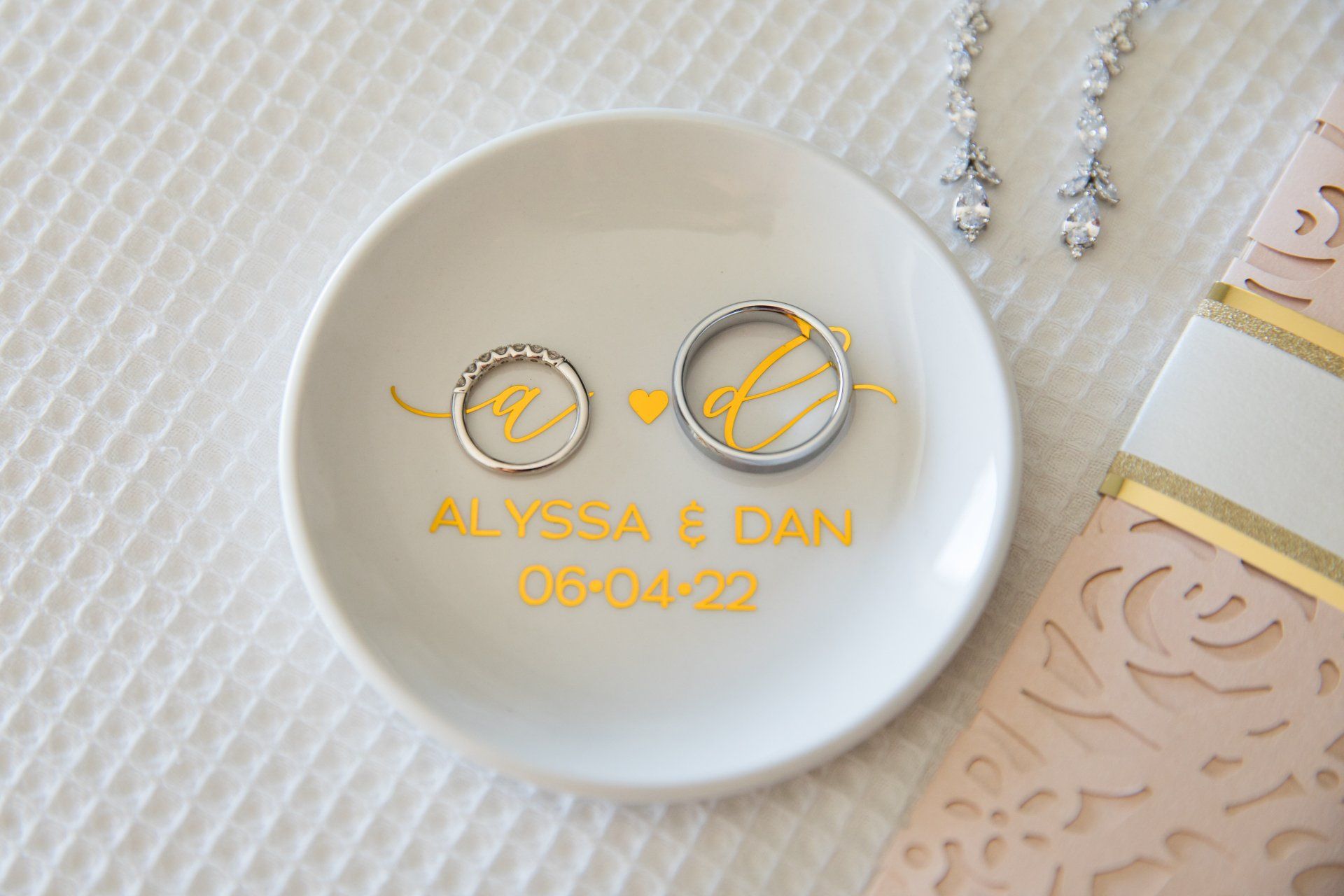 Personalized white plate with gold rings and engraved names Alyssa & Dan, 06-04-22