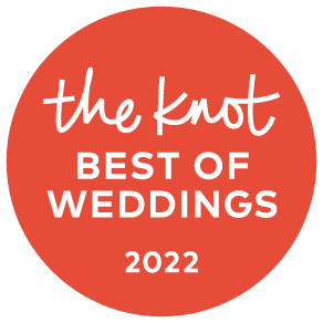 The Knot Best of Weddings 2022 award badge on a coral circle with white text