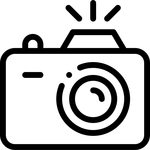 Black outline icon of a camera with flash bursts on a white background