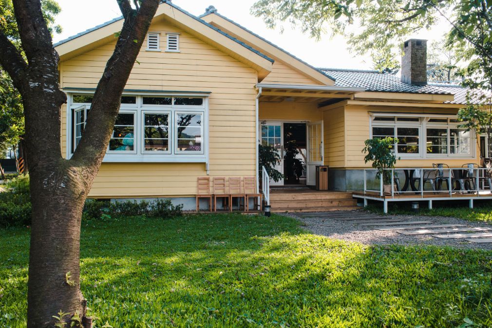 House With Wooden Window And Green Grass — Cleaners in Sunshine Coast, QLD