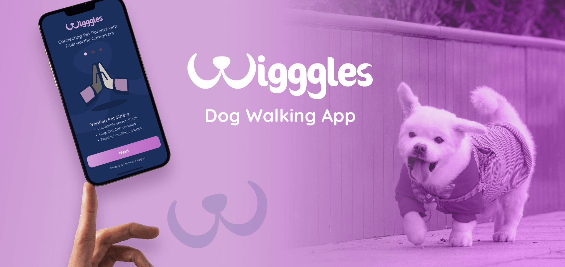 A person is holding a cell phone next to a dog.
