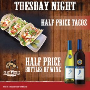 Tuesday night promo for half-price tacos and wine bottles on a wood background.