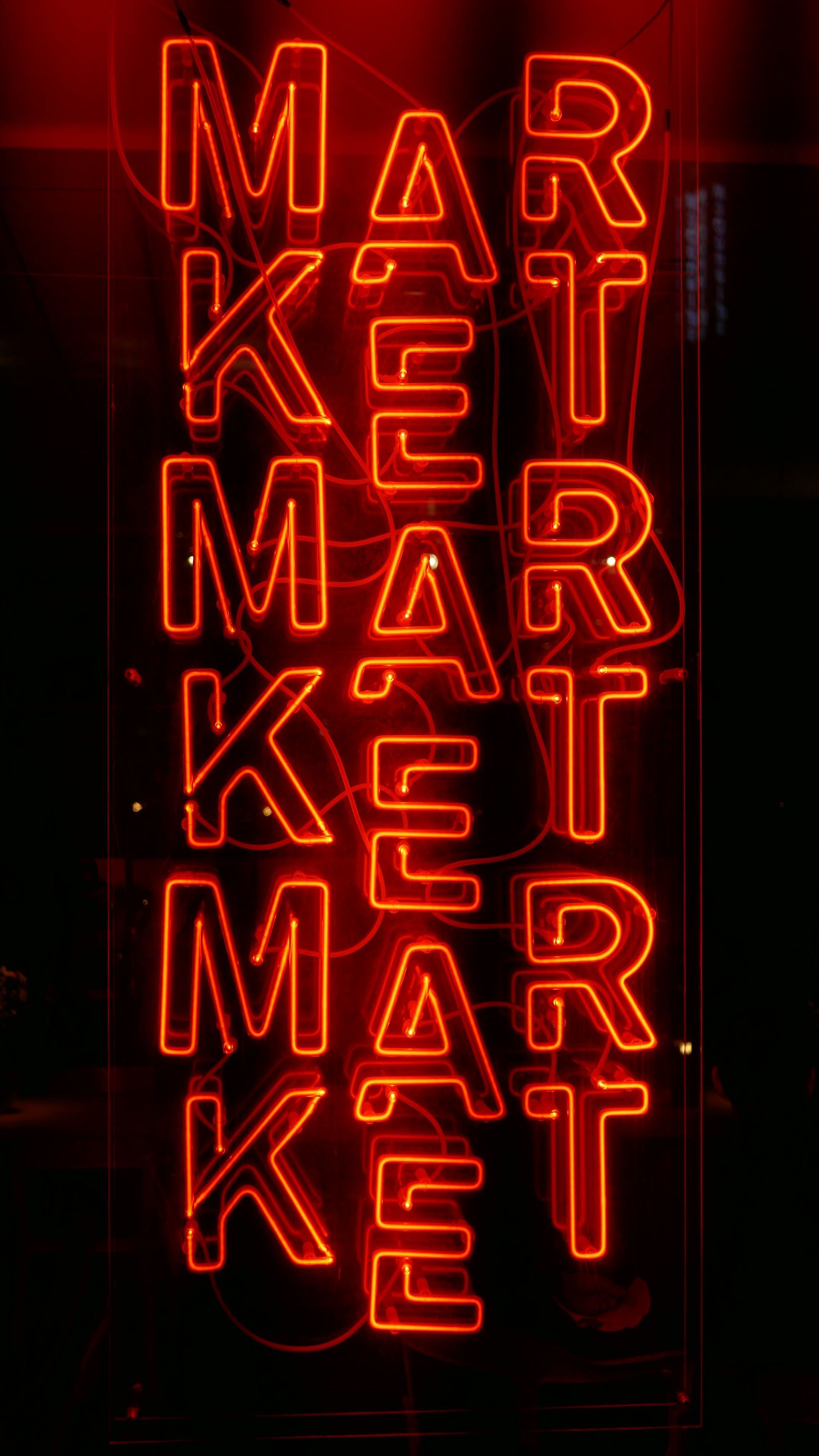 A neon sign that says market on it