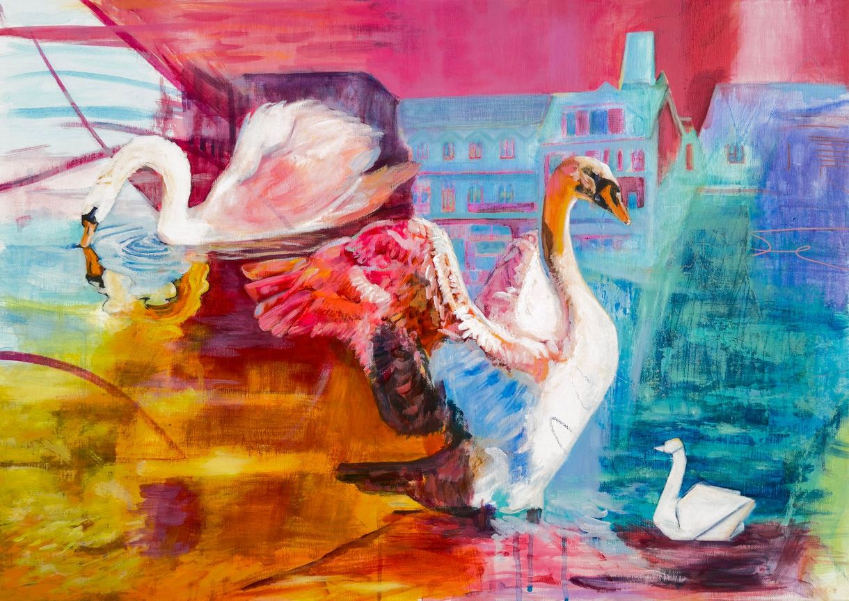 Swans in vibrant colors, wings spread, near a building.