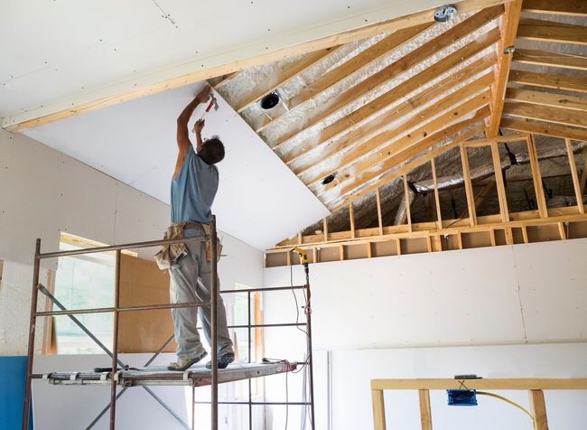 Contractor installing a drywall ceiling in Lakewood, CO