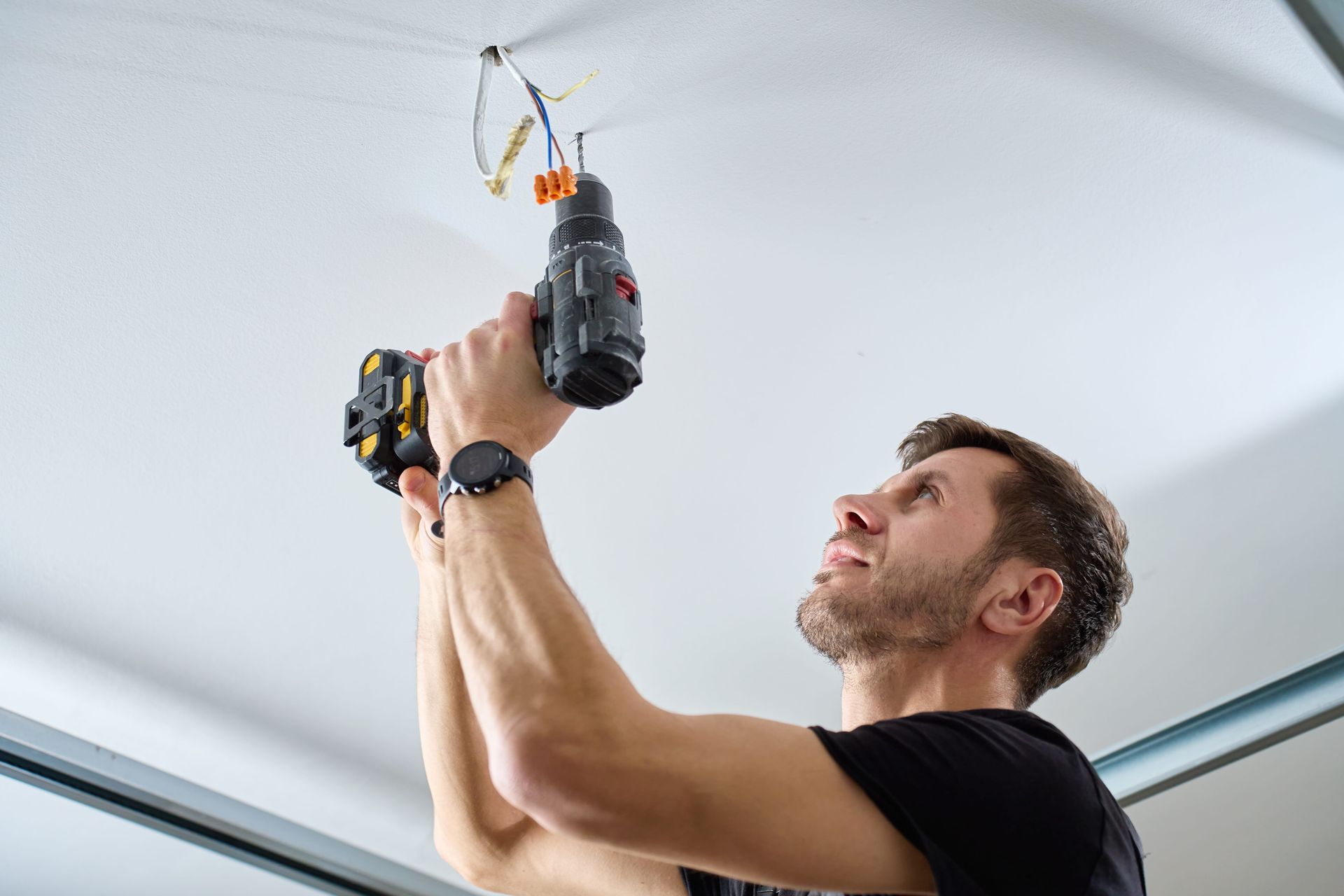 Residential electrician performing wiring installation