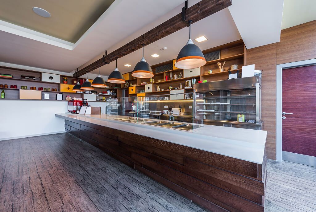 Stylish pendant lights installed over a restaurant counter for ambiance