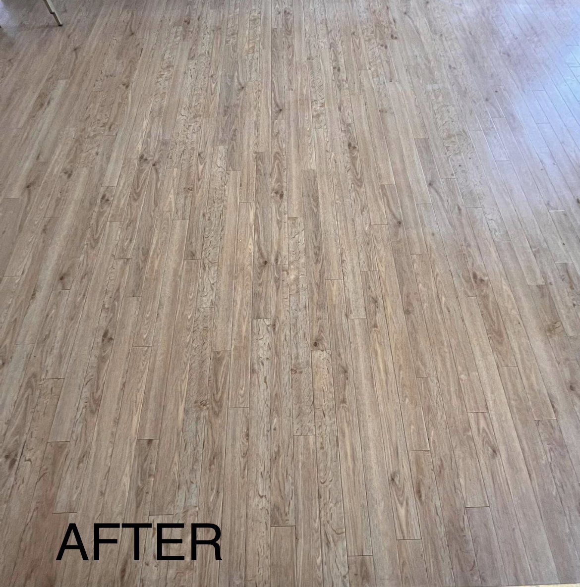 A picture of a wooden floor after being cleaned.