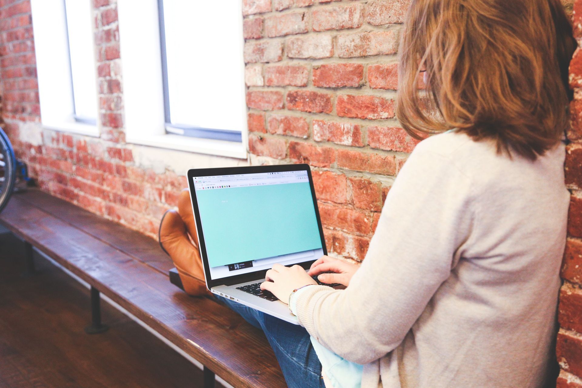 Woman Using Laptop in Houston, TX