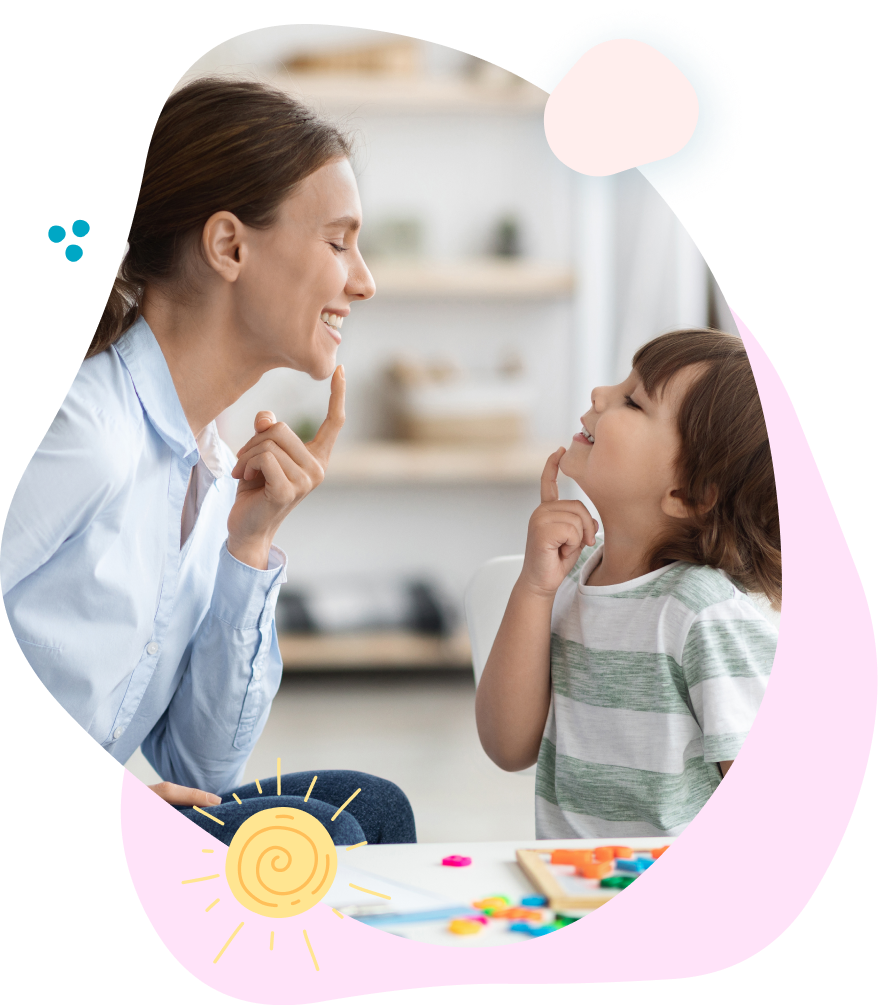 A woman and a child are sitting at a table talking to each other.