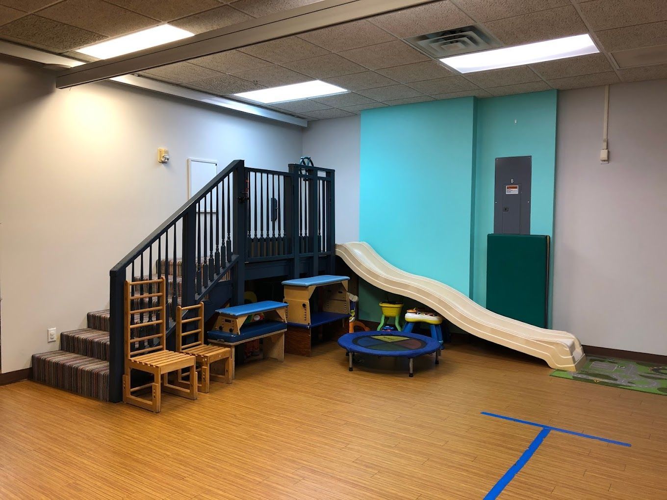 There is a slide in the middle of the room.