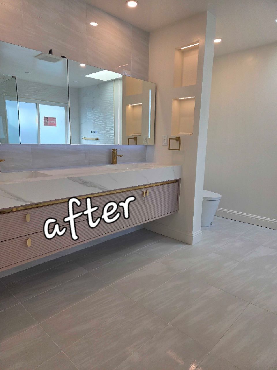 Modern bathroom with double sinks, mirrors, and beige tile, labeled “after” at the vanity.