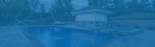 Blue-tinted view of a house behind a garden fountain and pond, with trees in the background