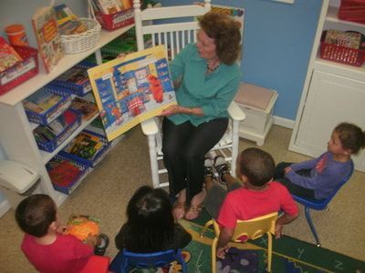 Volunteer reading with children