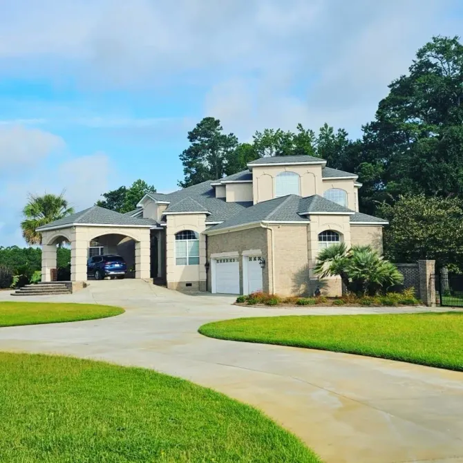 A large house with a car parked in front of it