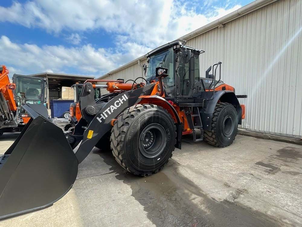 Bulldozer Parked at the Back of the Building — Statement of Attainment Mid North Coast