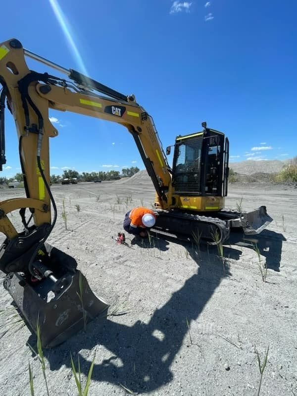 Man Checking Excavator — Plant Operator Courses Muswellbrook