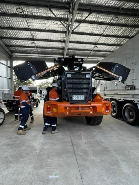 Workers Inspecting Truck — Plant Operator Courses Muswellbrook