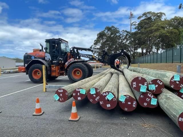 Trainee Bulldozer Driver Learning to Pick Up Logs — Plant Operator Courses Muswellbrook