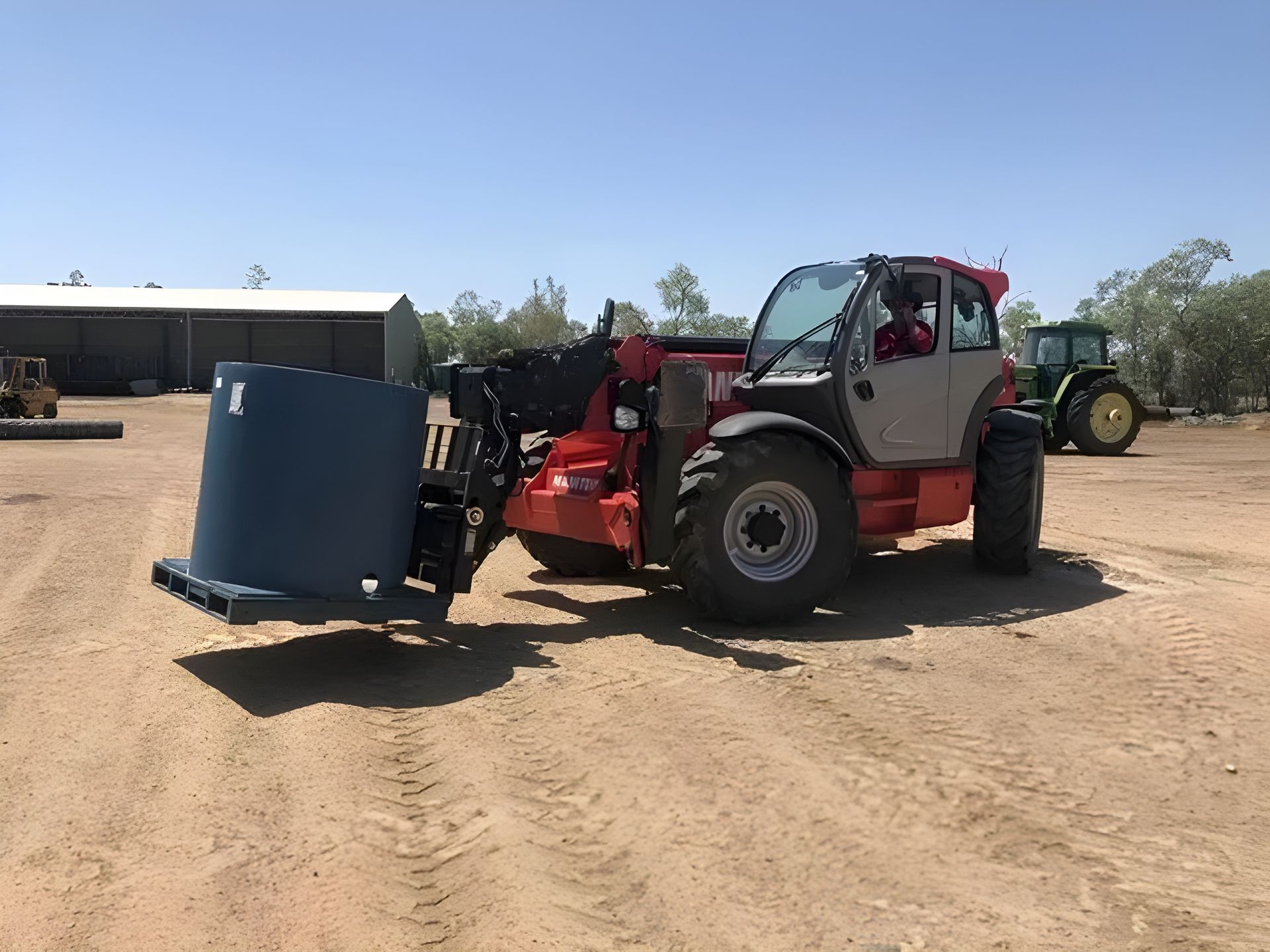 Forklift Transporting a Large Blue Cylinder on a Pallet — Statement of Attainment Muswellbrook